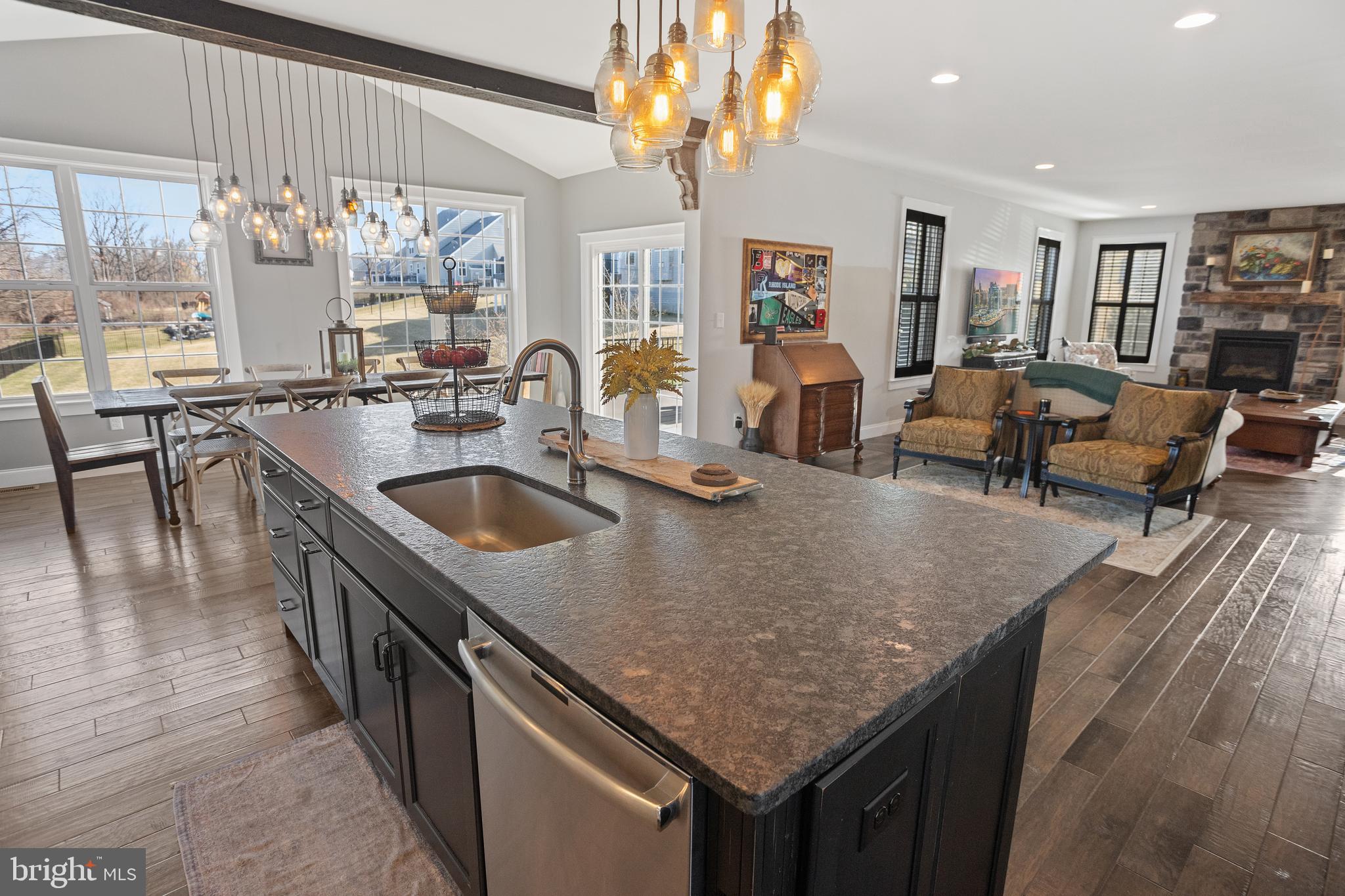 33 Docwill Drive Barto, PA 19504 - Photo 13 of 54 a kitchen with stainless steel appliances granite countertop a sink a stove and a wooden floors