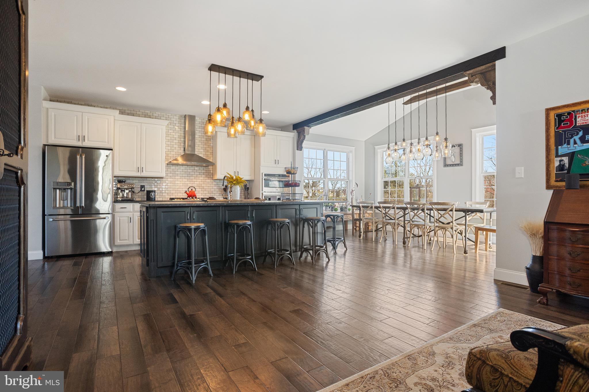 33 Docwill Drive Barto, PA 19504 - Photo 16 of 54 a kitchen with stainless steel appliances a dining table chairs stove refrigerator and cabinets