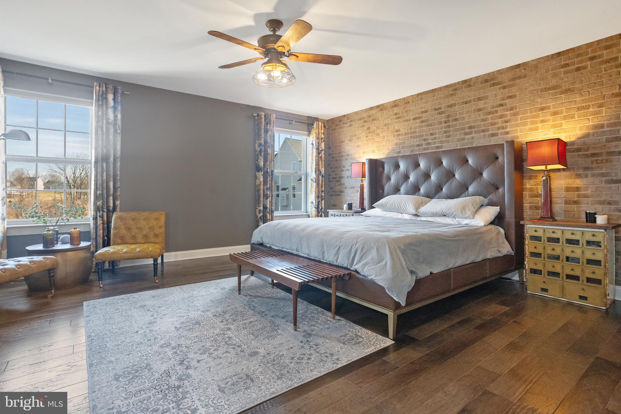 33 Docwill Drive Barto, PA 19504 - Photo 37 of 54 a bedroom with a bed a couch and a dresser next to a window