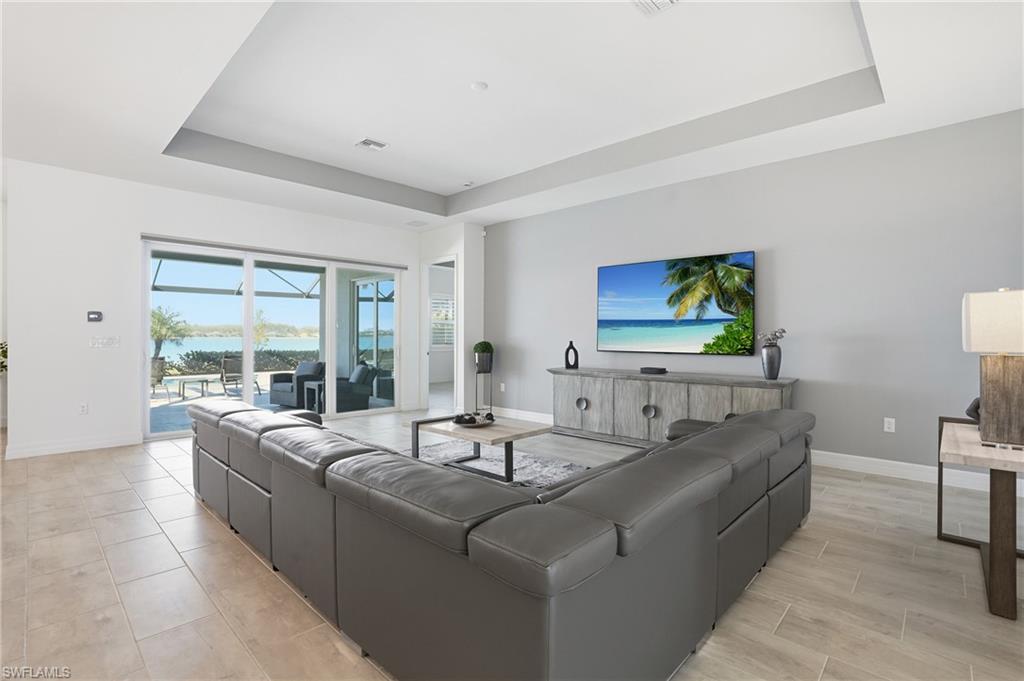 13686 Blue Bay Circle Fort Myers, FL 33913 - Photo 12 of 50 a living room with furniture and a flat screen tv
