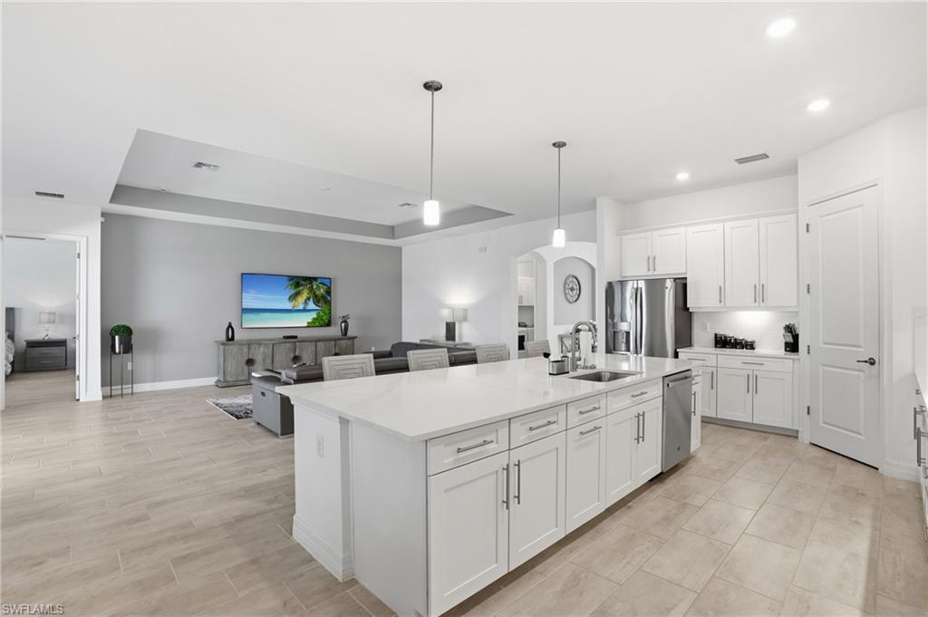 13686 Blue Bay Circle Fort Myers, FL 33913 - Photo 49 of 50 a large white kitchen with a large counter top appliances and cabinets
