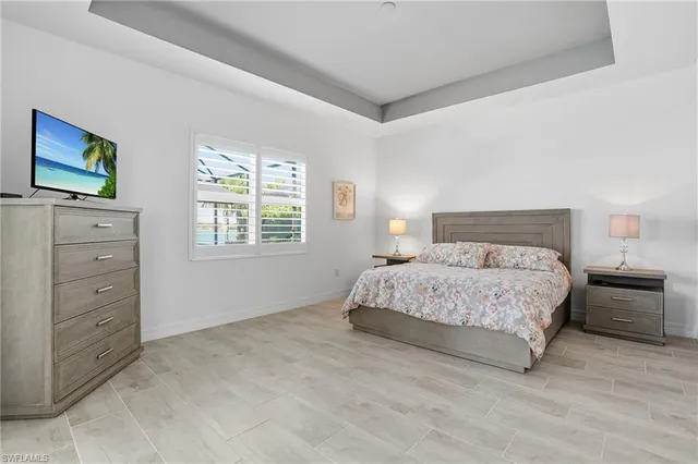 a dining room with furniture a window and a chandelier