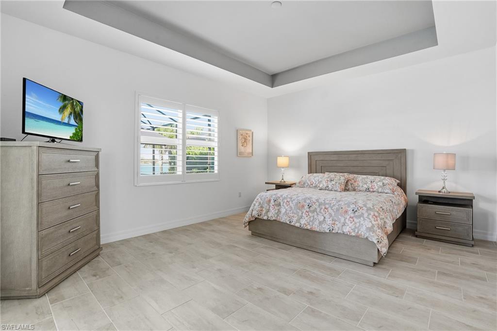 13686 Blue Bay Circle Fort Myers, FL 33913 - Photo 18 of 50 a bedroom with a bed and a window