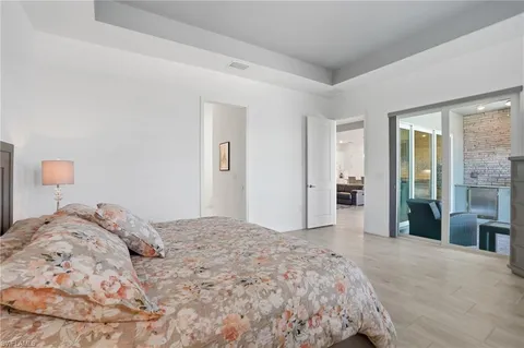 a view of a dining room with furniture wooden floor and chandelier
