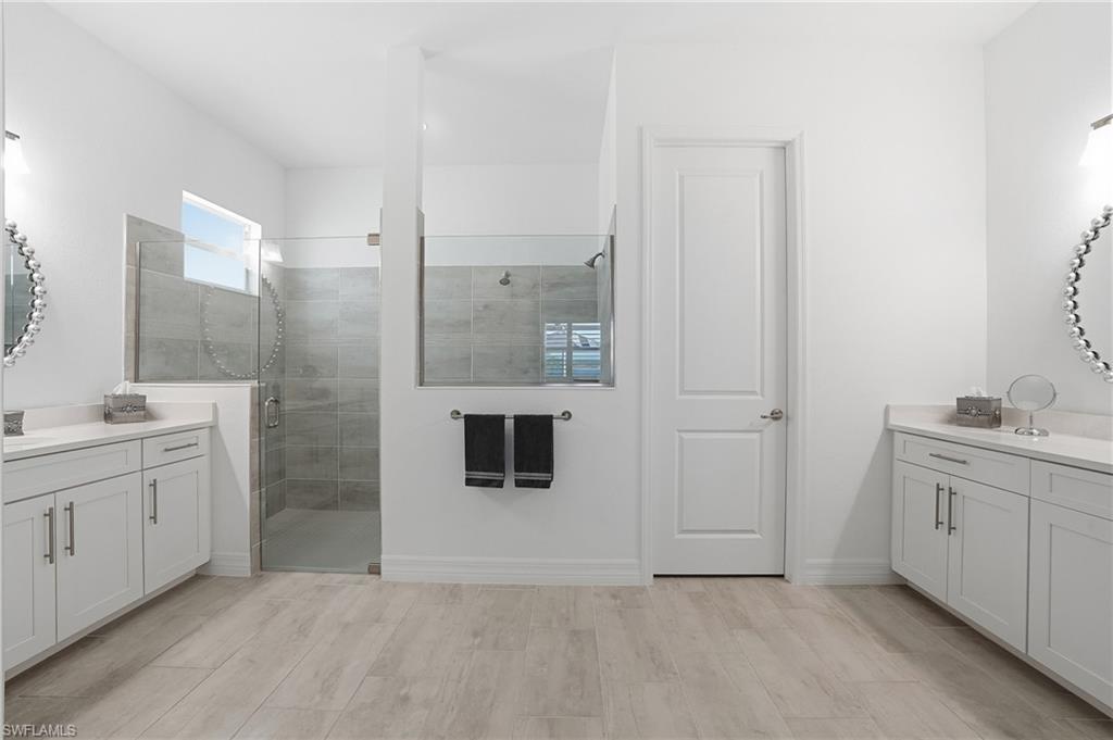 13686 Blue Bay Circle Fort Myers, FL 33913 - Photo 21 of 50 a bathroom with a sink and a mirror