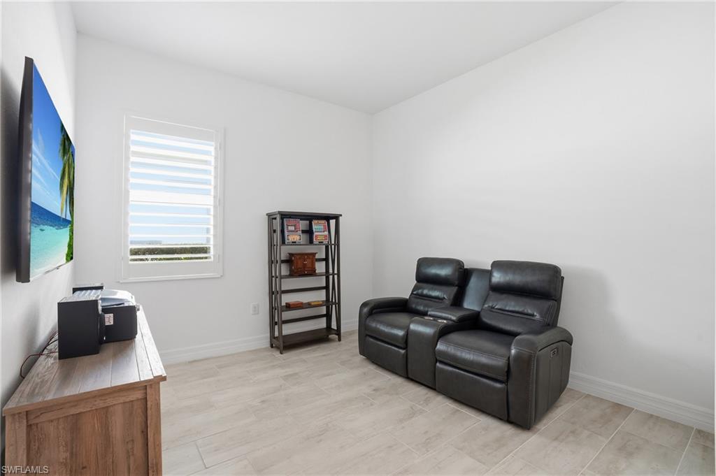 13686 Blue Bay Circle Fort Myers, FL 33913 - Photo 27 of 50 a living room with furniture and a flat screen tv