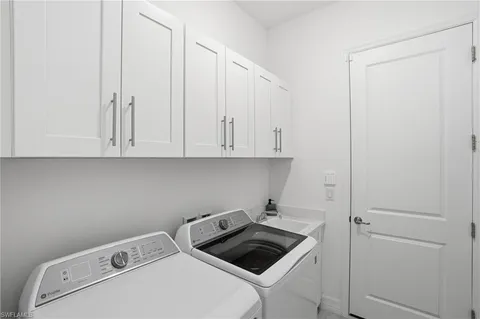 a bathroom with a sink mirror toilet and bathtub