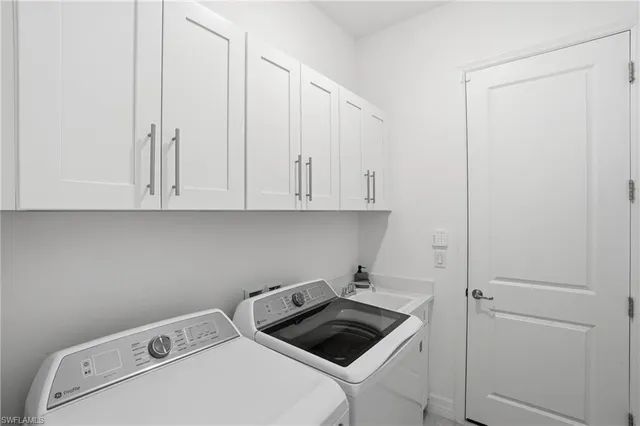 a bathroom with a sink mirror toilet and bathtub