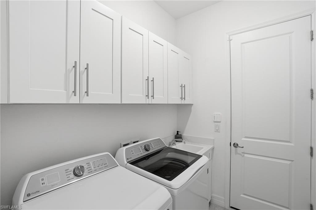 13686 Blue Bay Circle Fort Myers, FL 33913 - Photo 31 of 50 a view of storage and utility room with washer and dryer