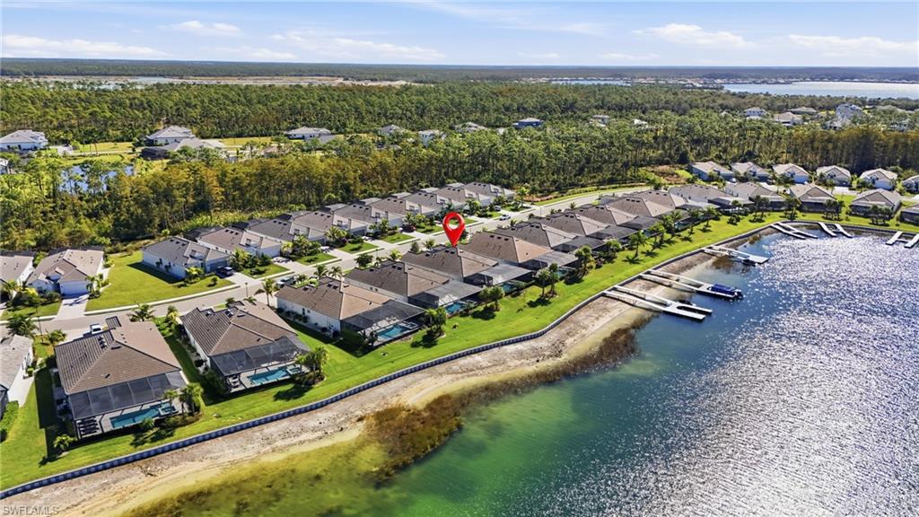 13686 Blue Bay Circle Fort Myers, FL 33913 - Photo 4 of 50 an aerial view of a city with lots of residential buildings and mountain view in back