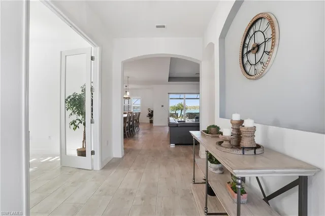 a dining room with furniture and wooden floor