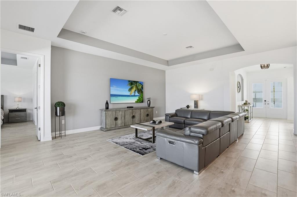13686 Blue Bay Circle Fort Myers, FL 33913 - Photo 9 of 50 a living room with furniture and a flat screen tv