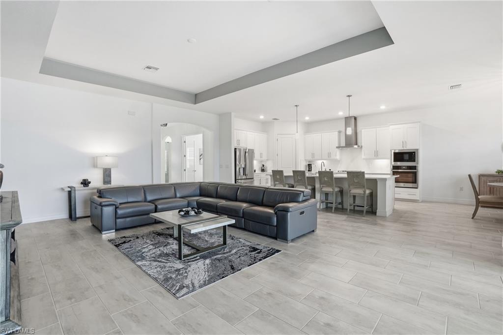13686 Blue Bay Circle Fort Myers, FL 33913 - Photo 10 of 50 a living room with furniture and kitchen view