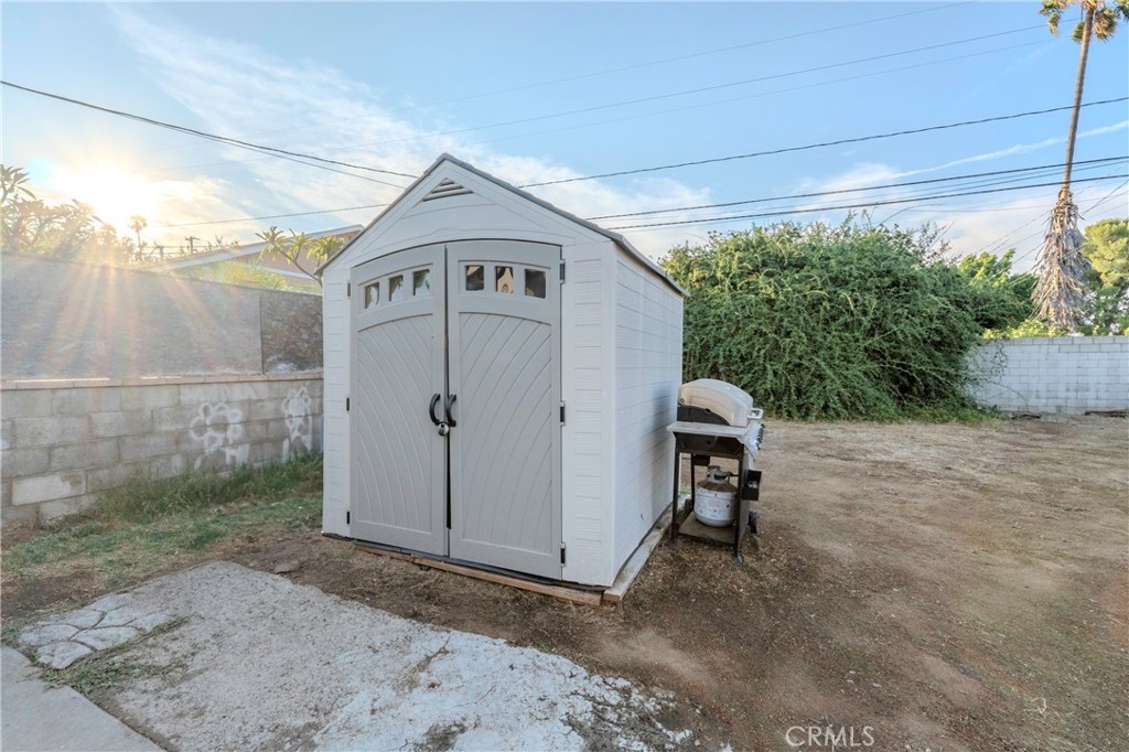 11661 Valverda Avenue Riverside, CA 92505 - Photo 18 of 39 a view of a house with a yard