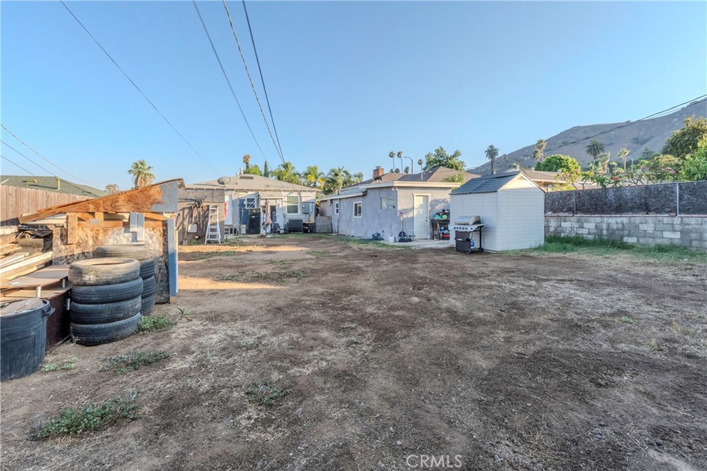 11661 Valverda Avenue Riverside, CA 92505 - Photo 20 of 39 a view of a chairs and table in backyard