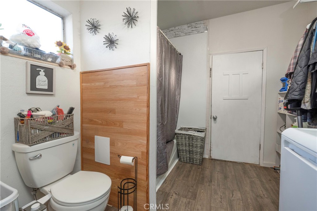 11661 Valverda Avenue Riverside, CA 92505 - Photo 22 of 39 a white toilet sitting next to a bathroom sink