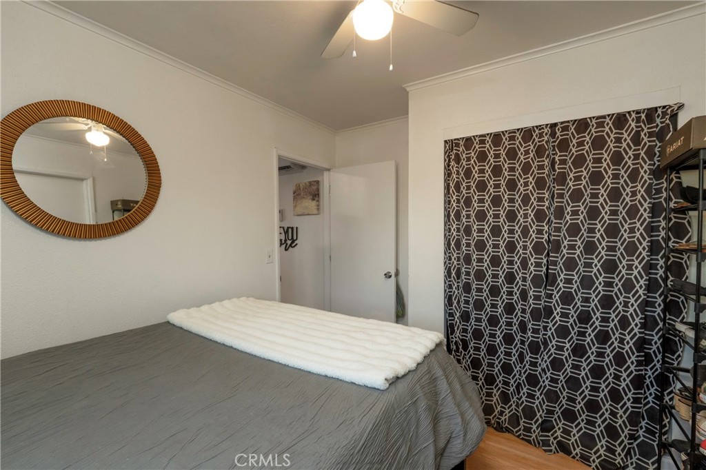 11661 Valverda Avenue Riverside, CA 92505 - Photo 26 of 39 a bedroom with a sink and a mirror