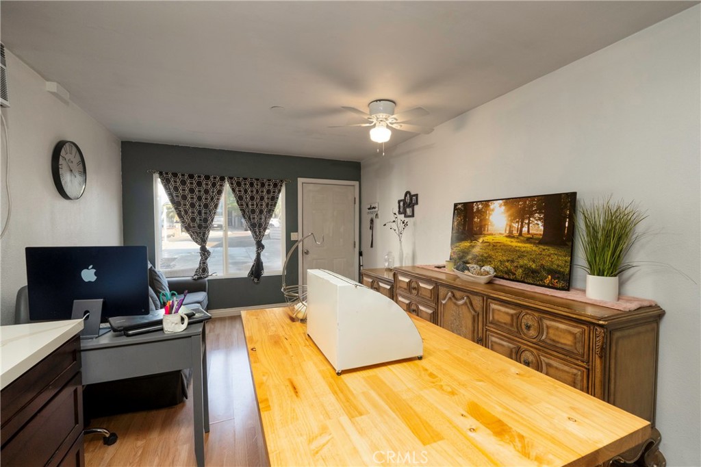 11661 Valverda Avenue Riverside, CA 92505 - Photo 28 of 39 a living room with furniture and a flat screen tv