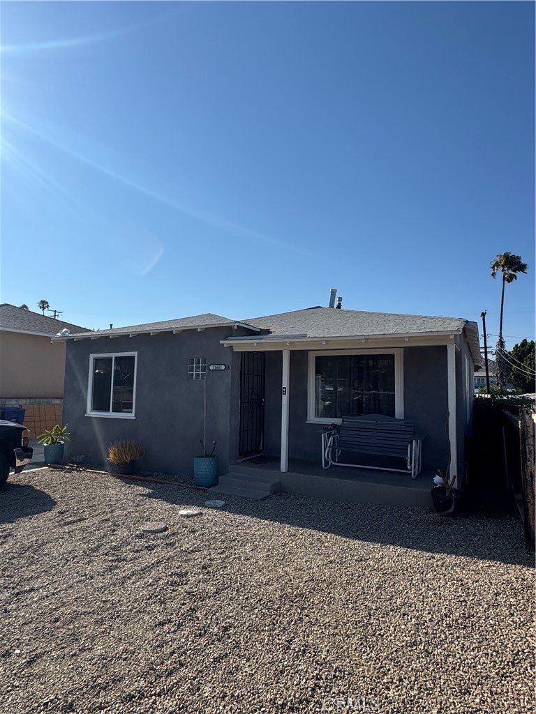 11661 Valverda Avenue Riverside, CA 92505 - Photo 3 of 39 a front view of a house with a yard