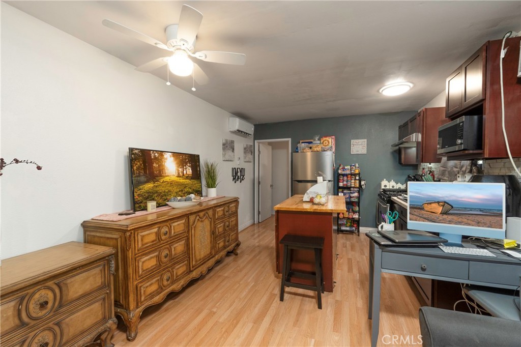 11661 Valverda Avenue Riverside, CA 92505 - Photo 34 of 39 a living room with furniture and a flat screen tv