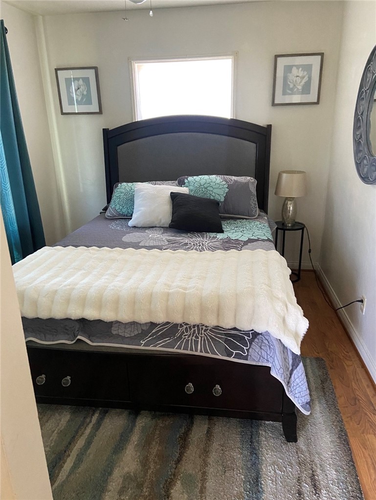 11661 Valverda Avenue Riverside, CA 92505 - Photo 5 of 39 a bed sitting in a bedroom next to a window