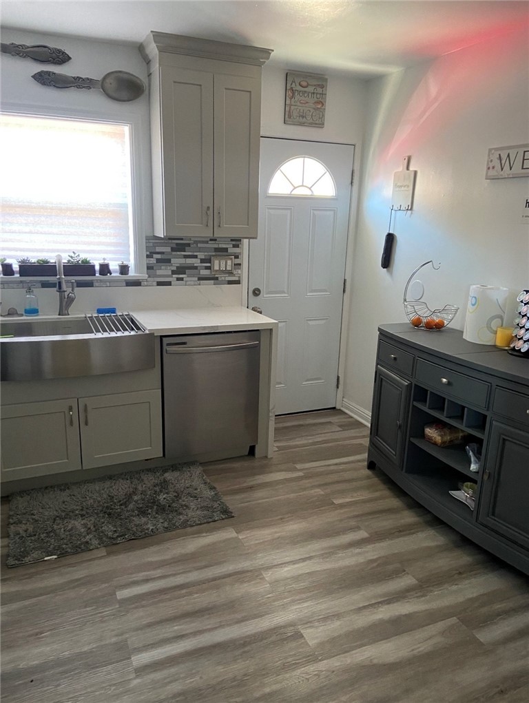 11661 Valverda Avenue Riverside, CA 92505 - Photo 8 of 39 a view of kitchen with cabinets and wooden floor