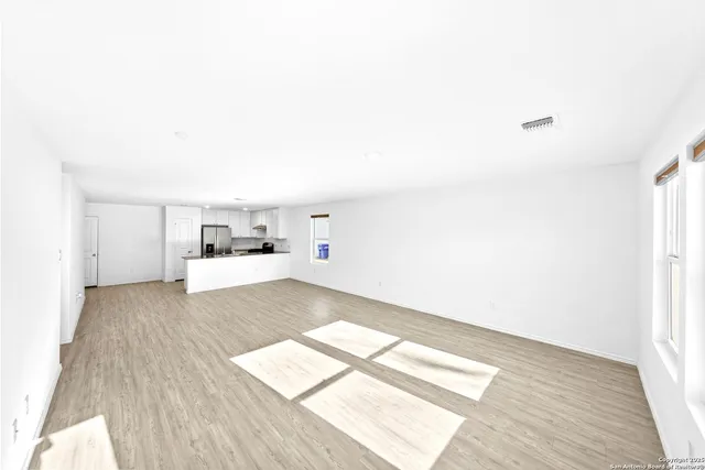 a kitchen with granite countertop a stove and a sink