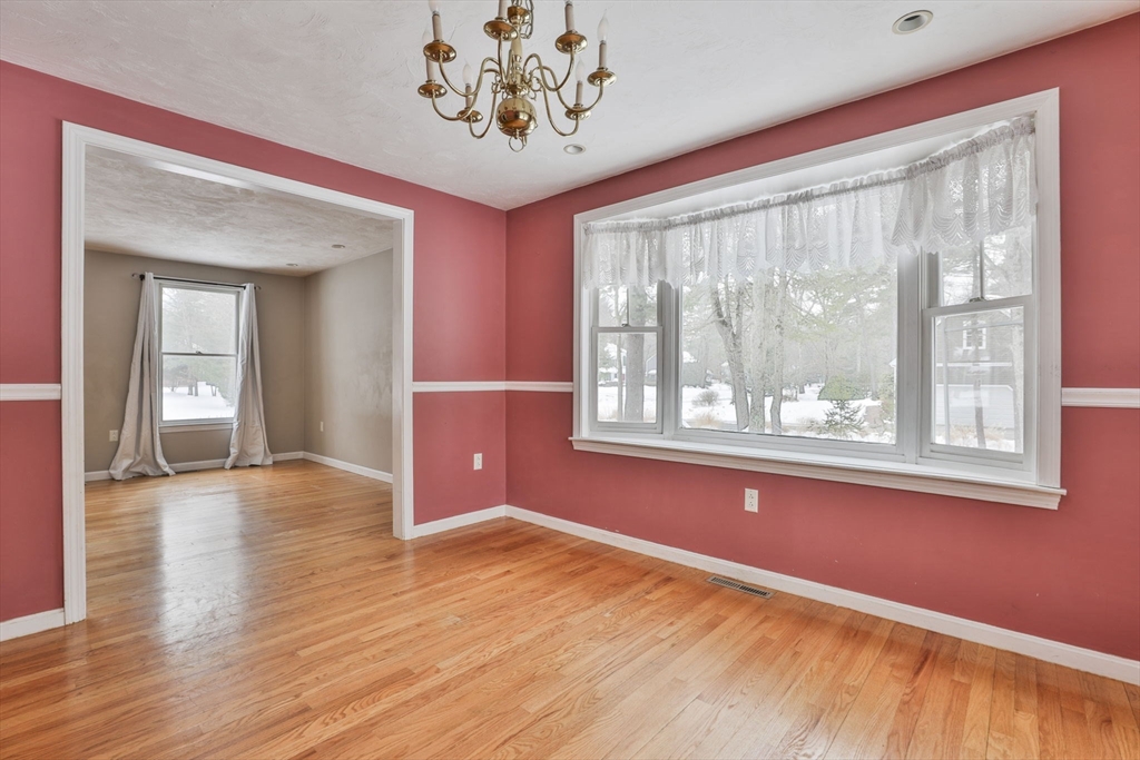 1 Deer Path Lane Mansfield, MA 02048 - Photo 13 of 31 a view of an empty room with a window and wooden floor