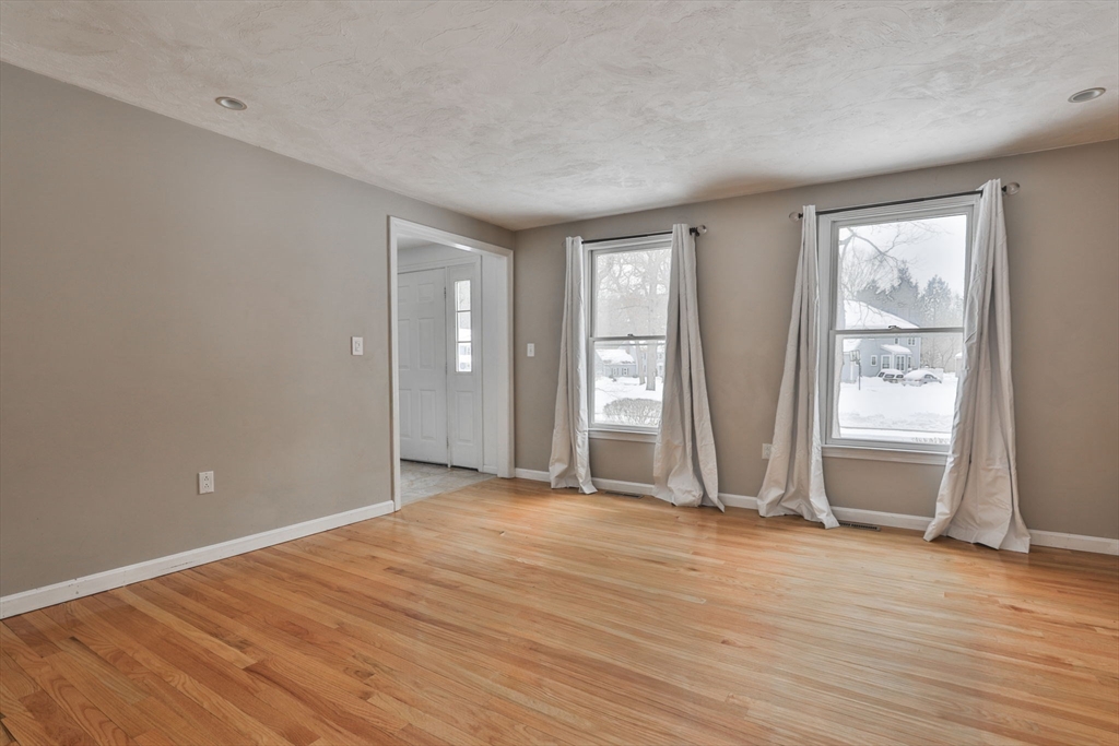 1 Deer Path Lane Mansfield, MA 02048 - Photo 14 of 31 an empty room with wooden floor and windows
