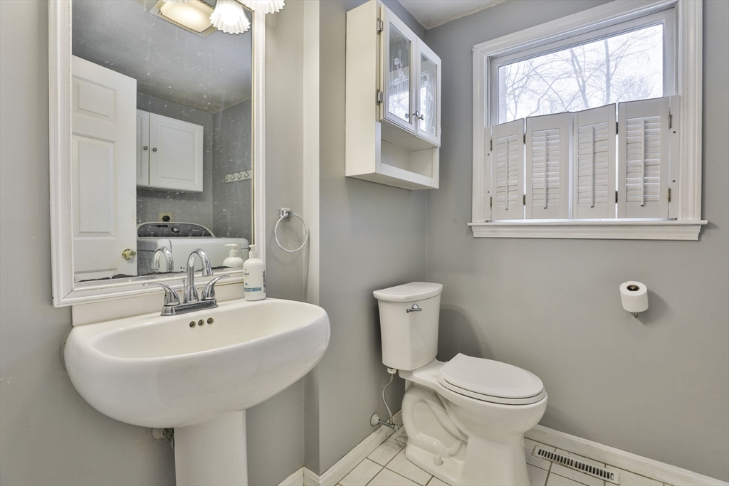 1 Deer Path Lane Mansfield, MA 02048 - Photo 16 of 31 a bathroom with a sink a toilet and mirror