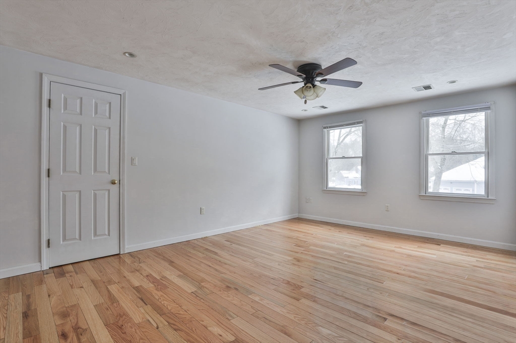 1 Deer Path Lane Mansfield, MA 02048 - Photo 19 of 31 wooden floor in an empty room with a window