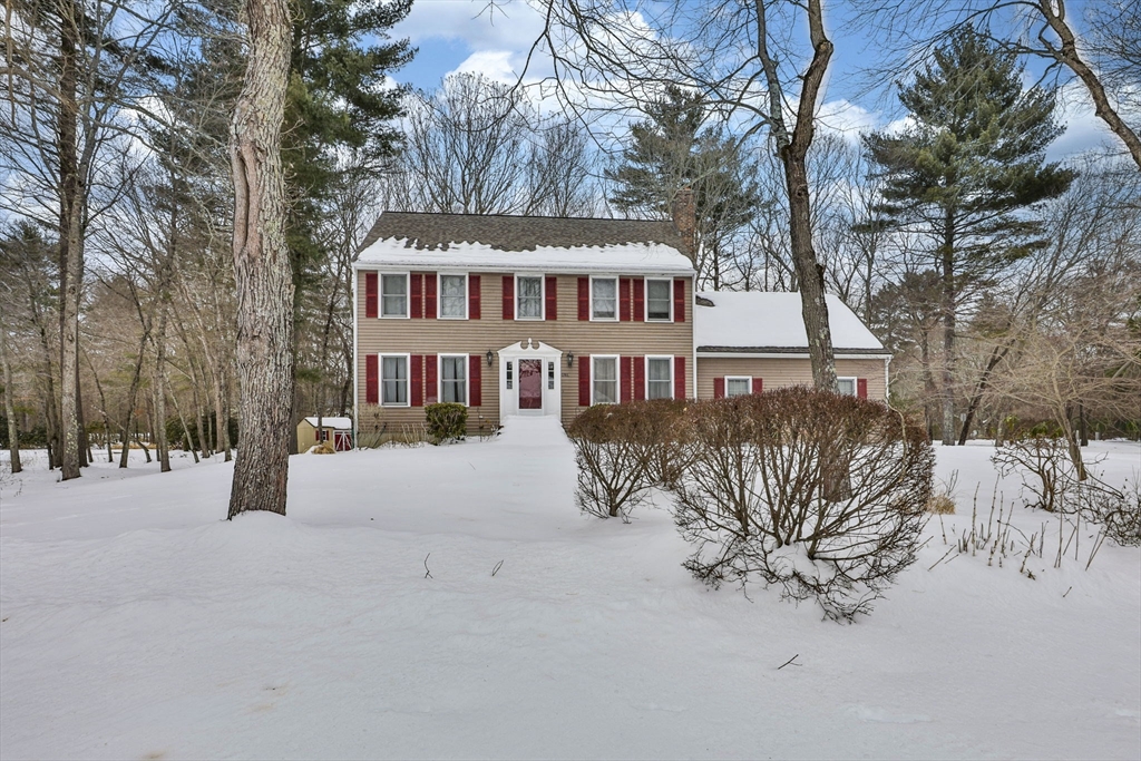 1 Deer Path Lane Mansfield, MA 02048 - Photo 2 of 31 a front view of a house with a yard covered with snow in front of house