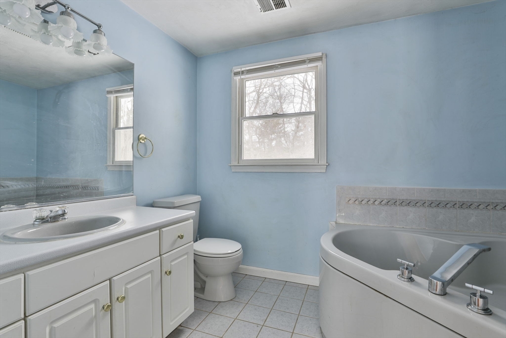 1 Deer Path Lane Mansfield, MA 02048 - Photo 21 of 31 a bathroom with a sink a toilet and a mirror