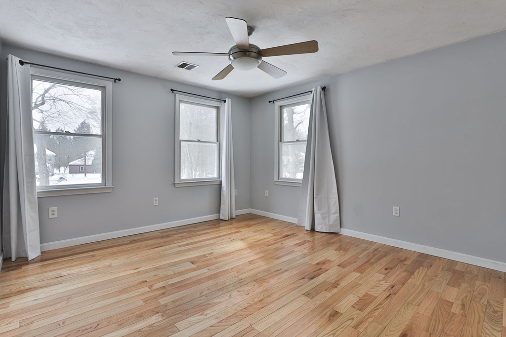 1 Deer Path Lane Mansfield, MA 02048 - Photo 28 of 31 a view of empty room with wooden floor and fan