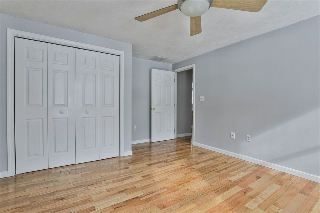 1 Deer Path Lane Mansfield, MA 02048 - Photo 29 of 31 a view of an empty room and wooden floor