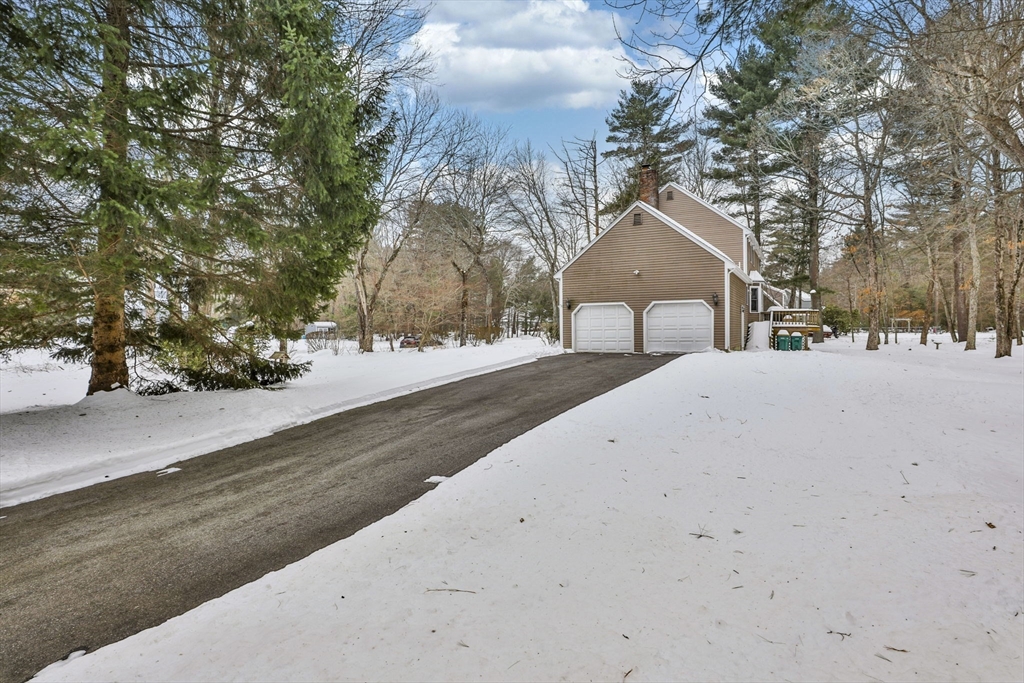 1 Deer Path Lane Mansfield, MA 02048 - Photo 31 of 31 a front view of a house with a yard covered with snow