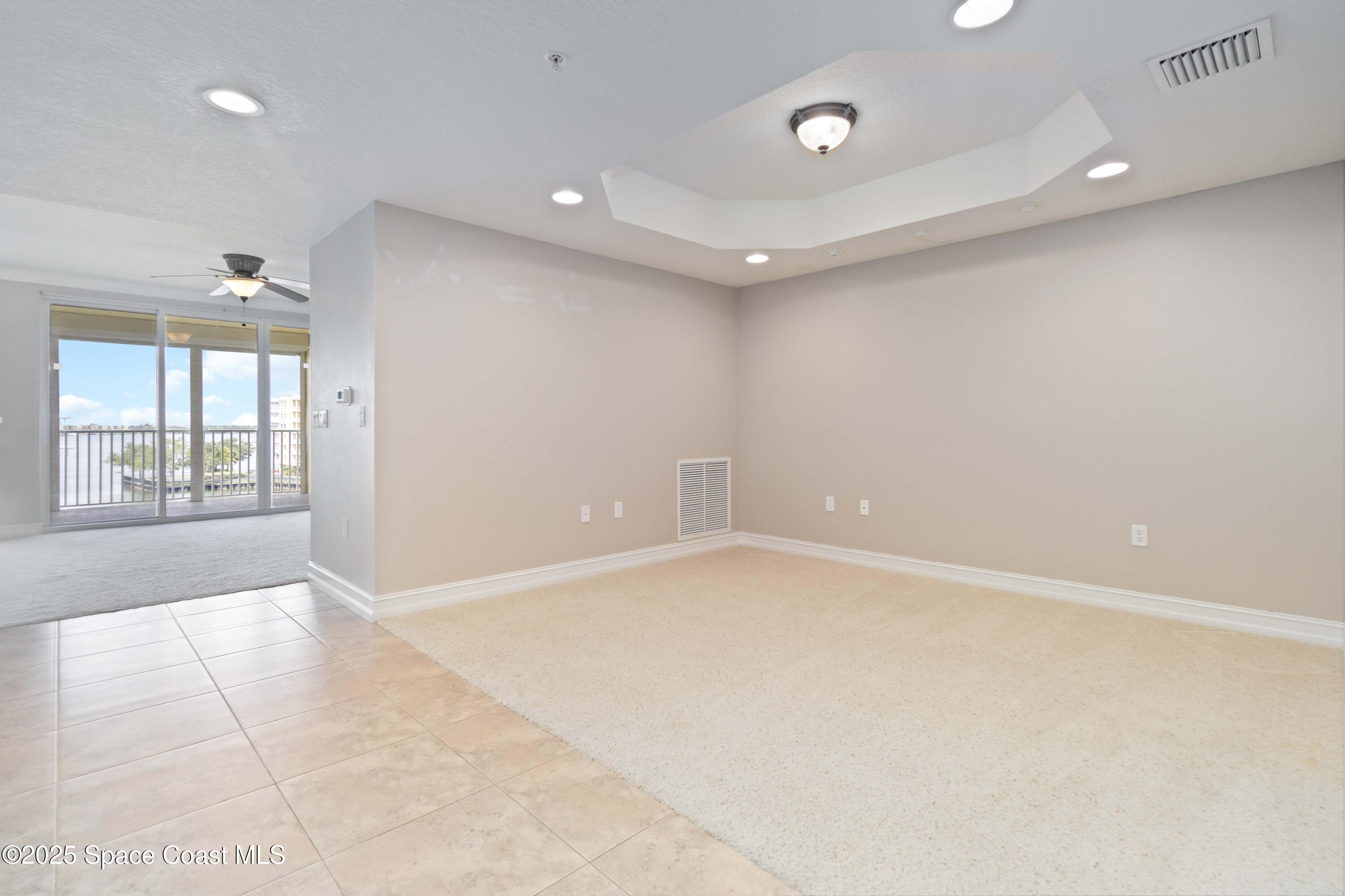 134 Starboard Lane, Unit 404 Merritt Island, FL 32953 - Photo 18 of 30 an empty room with windows and entrance