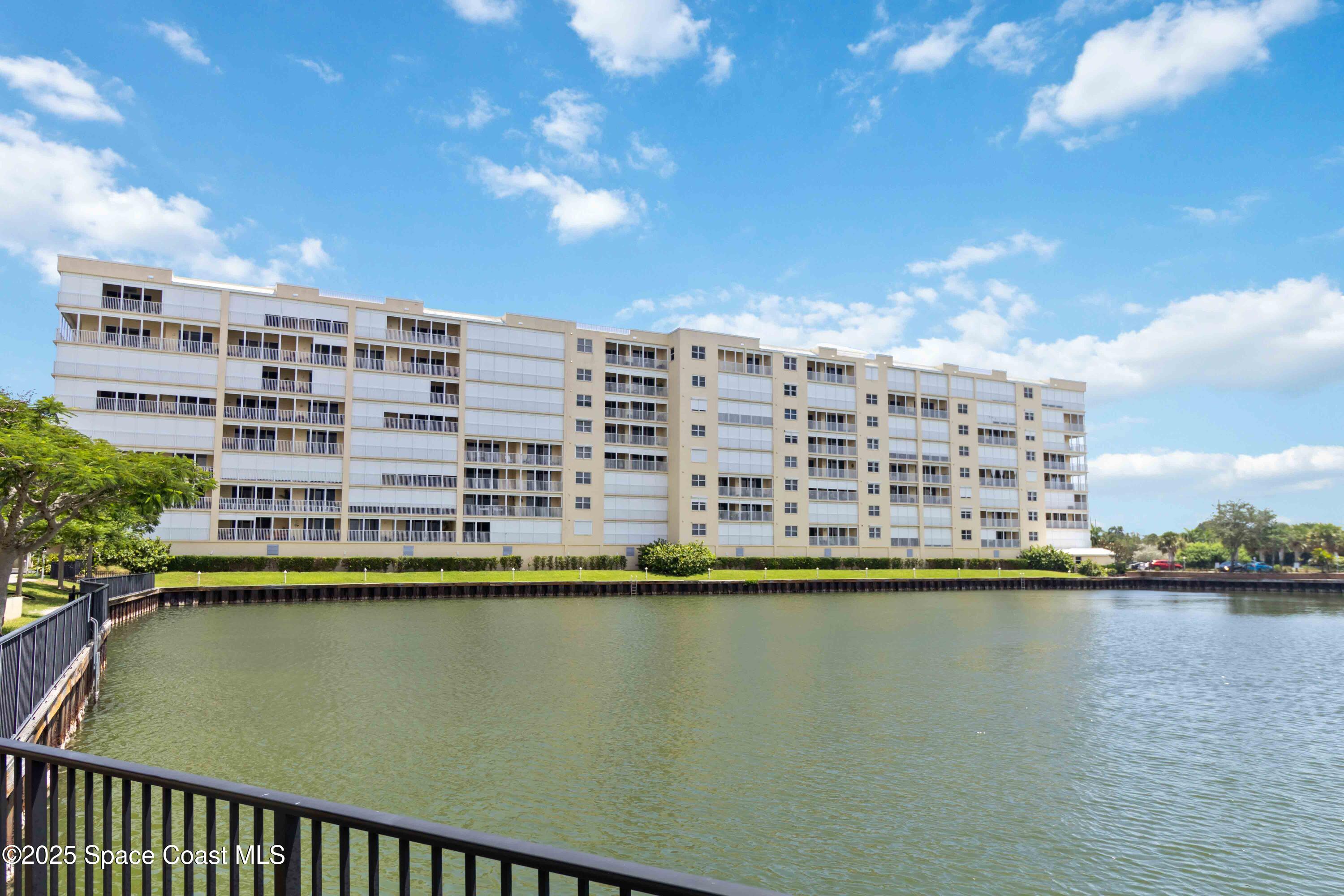 134 Starboard Lane, Unit 404 Merritt Island, FL 32953 - Photo 29 of 30 a view of a water with tall building