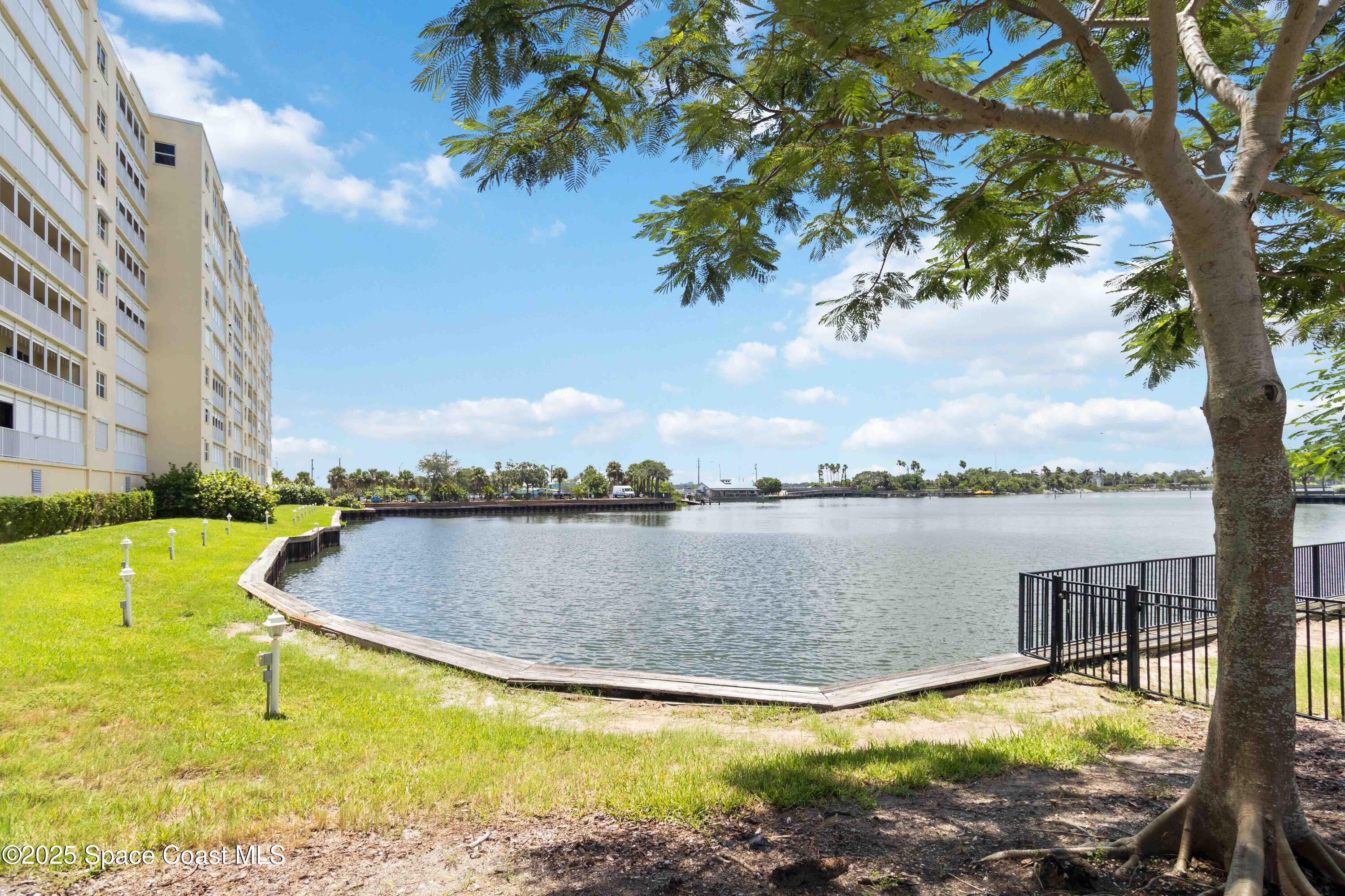 134 Starboard Lane, Unit 404 Merritt Island, FL 32953 - Photo 30 of 30 a view of a lake with a mountain