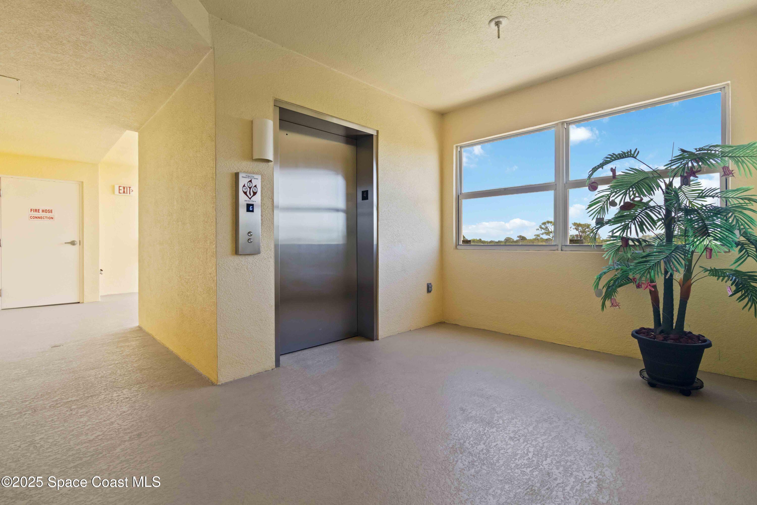 134 Starboard Lane, Unit 404 Merritt Island, FL 32953 - Photo 4 of 30 a view of a room with a potted plant