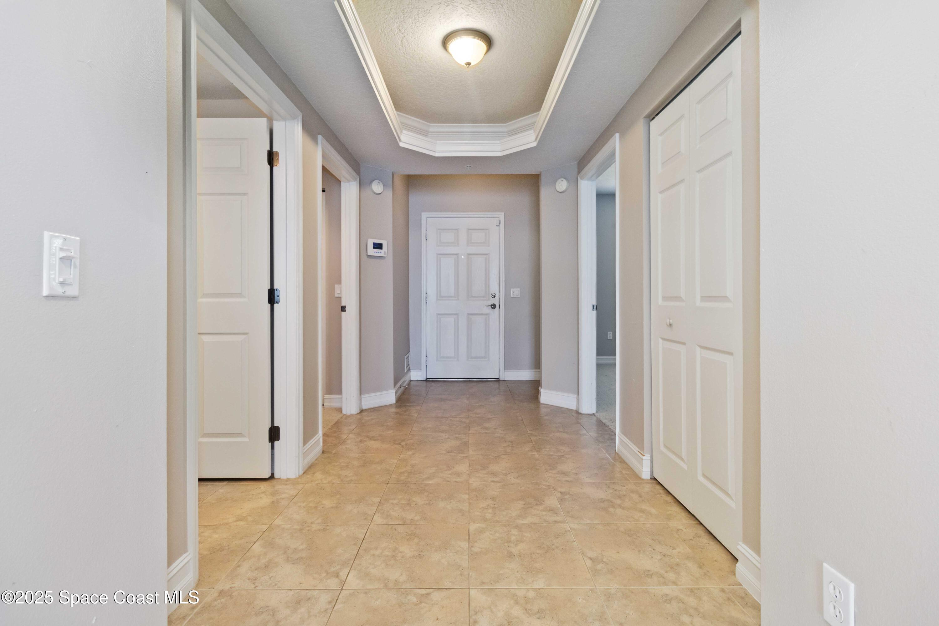 134 Starboard Lane, Unit 404 Merritt Island, FL 32953 - Photo 5 of 30 a view of a hallway