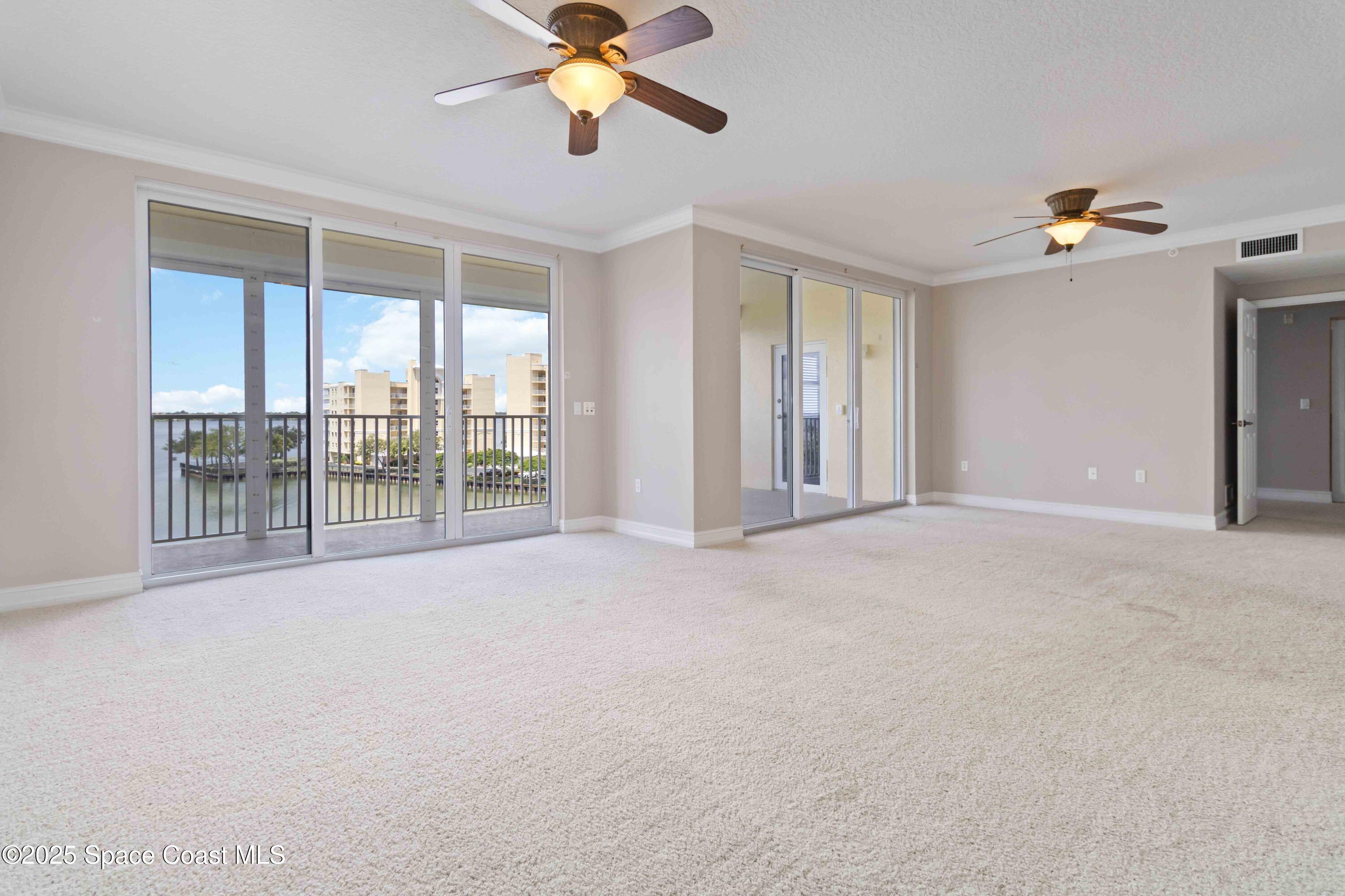 134 Starboard Lane, Unit 404 Merritt Island, FL 32953 - Photo 6 of 30 a view of an empty room with a window