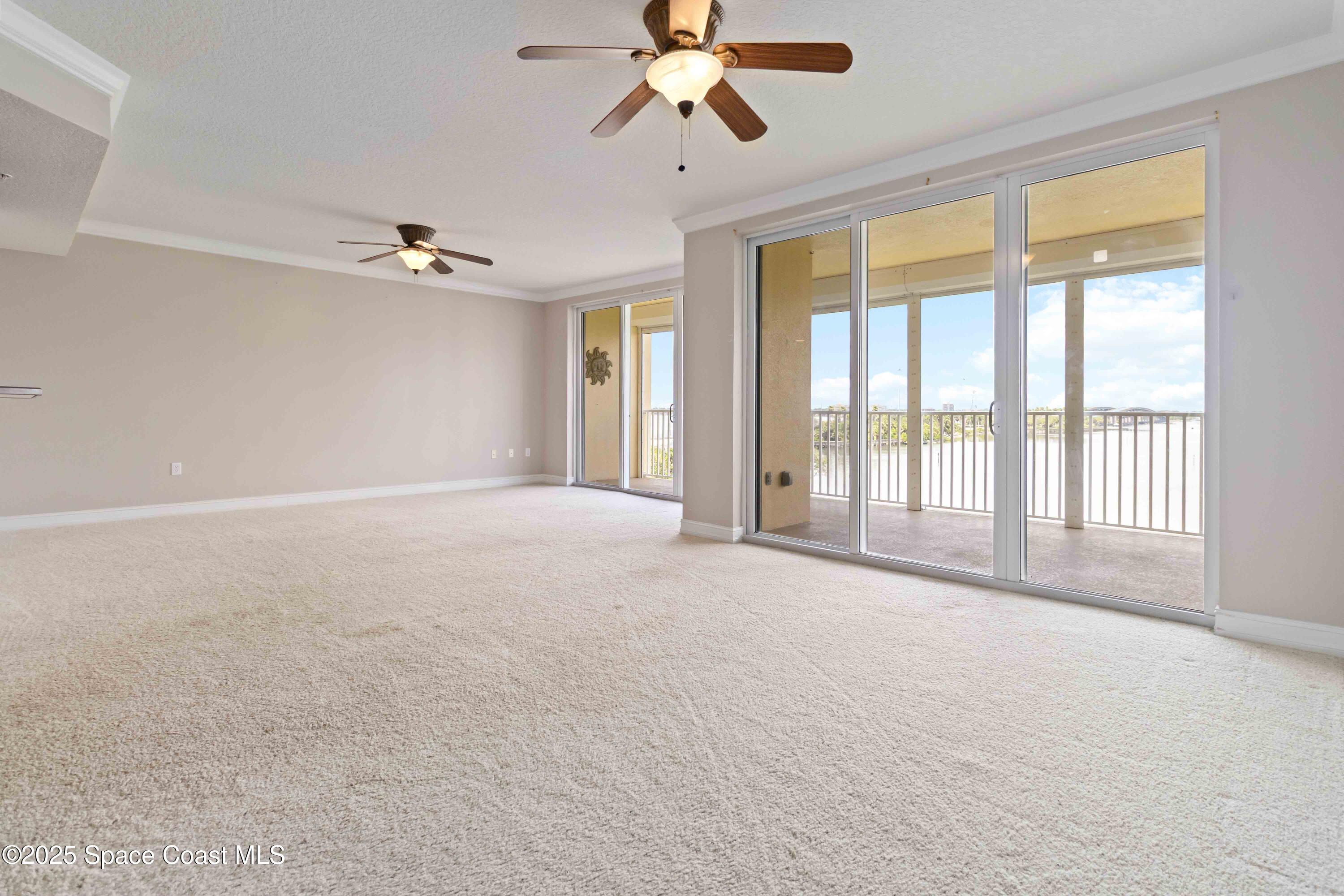 134 Starboard Lane, Unit 404 Merritt Island, FL 32953 - Photo 7 of 30 a view of an empty room with a window