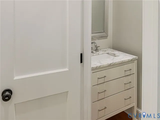 a bathroom with a bathtub and a sink