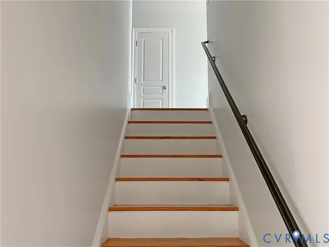 a bathroom with a toilet and a tub