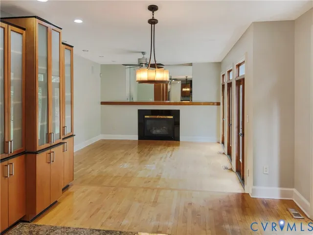 a kitchen with a refrigerator and a stove top oven