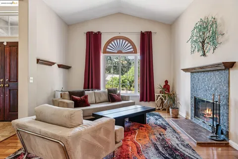 a dining room with furniture and wooden floor