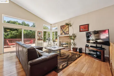 a kitchen with stainless steel appliances wooden cabinets a sink and a refrigerator