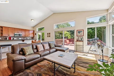 a kitchen with stainless steel appliances granite countertop a refrigerator a stove and a sink