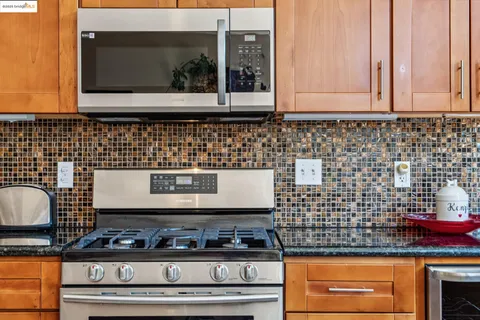 a bathroom with a sink toilet a mirror and shower